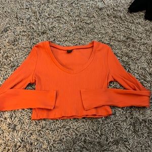 orange long sleeved V neck crop top